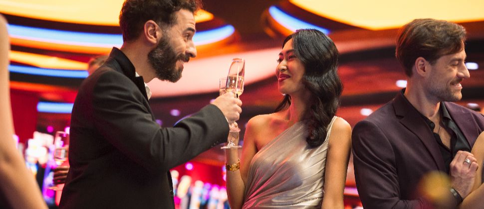 Best Nightclub Birthday Packages in Las Vegas 1 Man and a woman toasting each other at a party